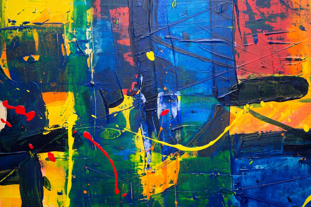 Abstract painting with vibrant colors including blue, yellow, green, orange, and red brushstrokes.